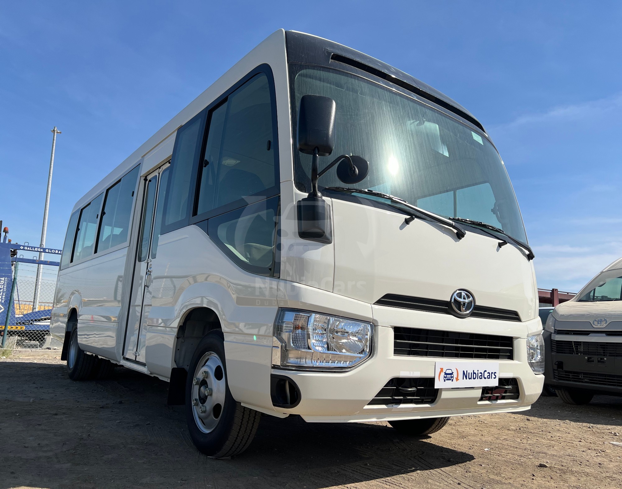 Toyota COSTER-MIN BUS The Toyota Coaster: A dependable, spacious minibus, designed for comfortable group travel with safety as a priority. - Rent Car Rwanda
